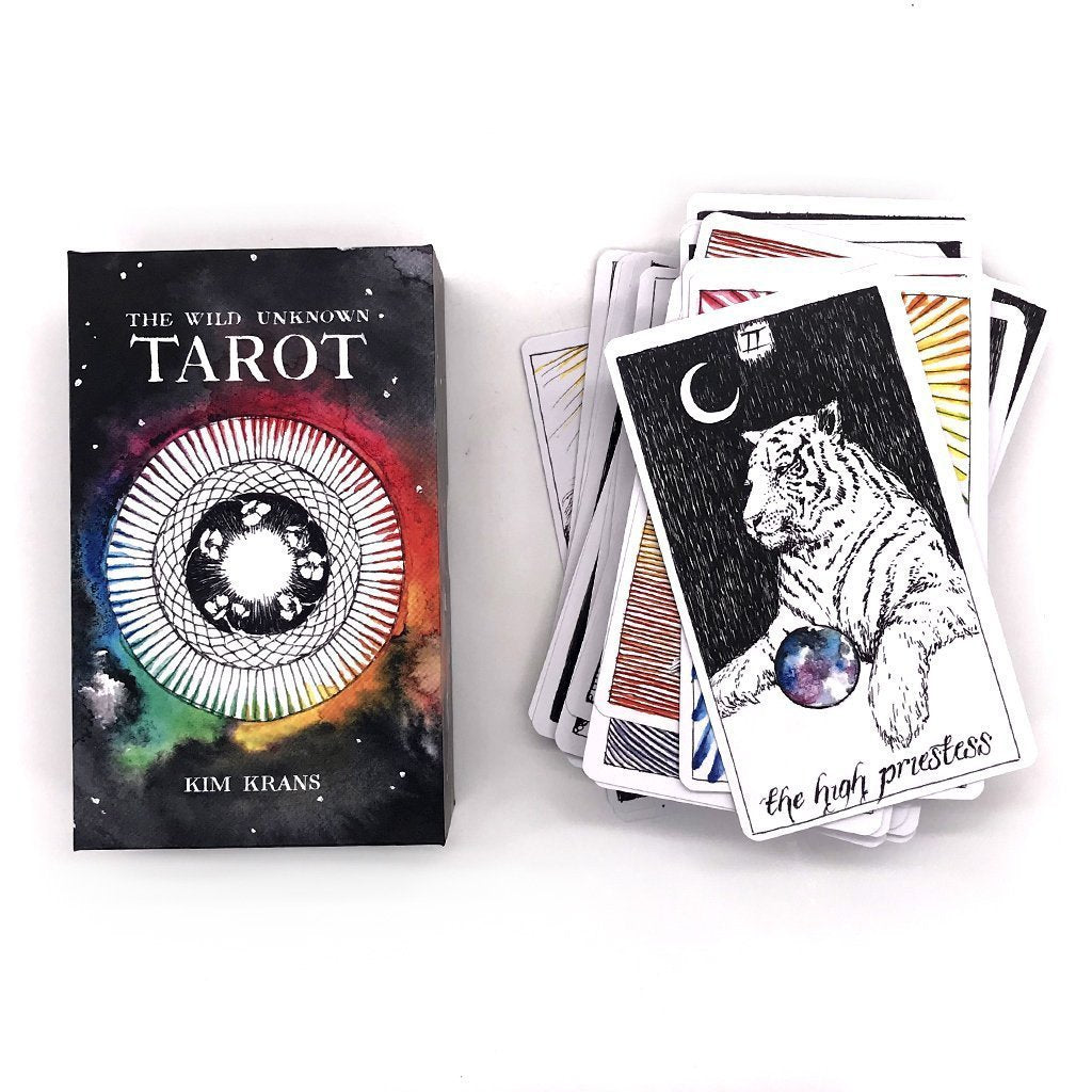 The High Priestess card from the Wild Unknown Tarot Deck and guidebook.