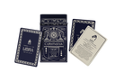 A deck of ritual cards labeled 'Curimonia' and 'Libra' with matching decorative boxes and cards, arranged on a light gray background.