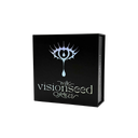 The Visionseed Oracle card deck box, a black rectangular package featuring a stylized silver eye logo and the text 'the visionseed ORACLE' on the front, shown on a plain white background.