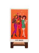 Card with three illustrated people celebrating three of cups 