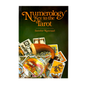The book cover of 'Numerology Key to the Tarot' by Sandor Konraad, featuring a dark green background, orange title text, and a central illustration of tarot cards with a horn and a magnifying glass.