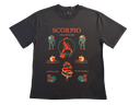 A black short-sleeve crewneck t-shirt featuring a detailed graphic print on the front. The graphic displays the word 'SCORPIO' in orange, surrounded by various tattoo-style illustrations of a scorpion, hearts, a snake, and figures in teal and orange.