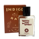 Indigo Ray 'With You In Spirit' Eau De Parfum 50ml bottle with a black cap next to its brown cardboard packaging box, on a white background.