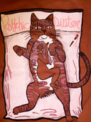 A brown crewneck sweatshirt featuring a graphic print of a woman with pink hiar curled up in the fetal position taking a nap on the underbelly of a  cartoon cat lounging on a pillow embroidered with the words Psychic Sister