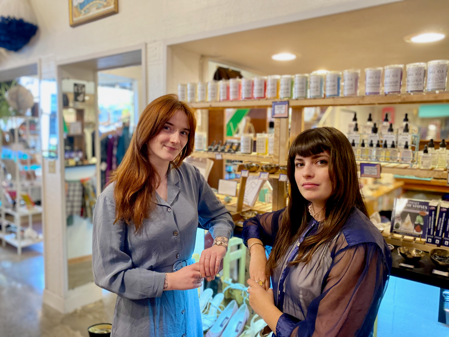 Two employees working at Psychic Sister Olympia Location.