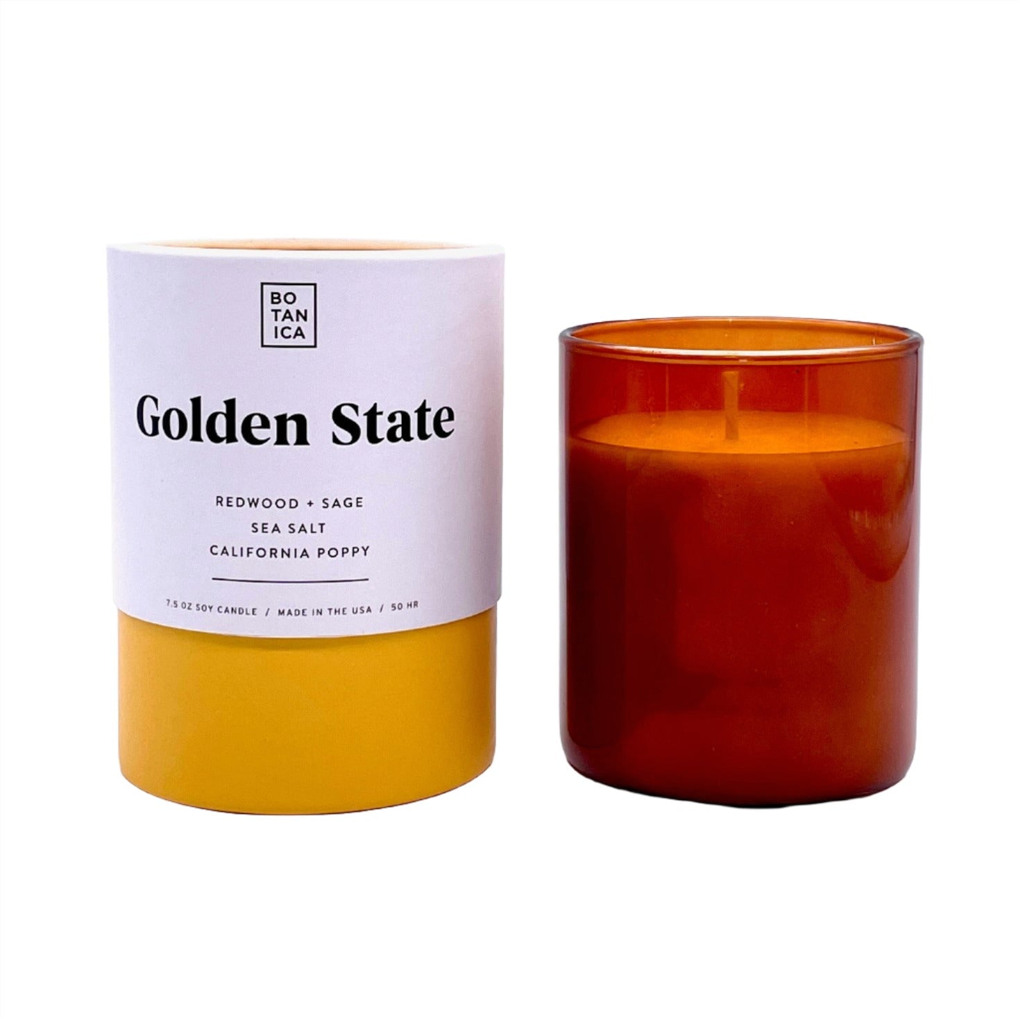 Amber Glass Candle next to White & Yellow Tube Package with Black Text