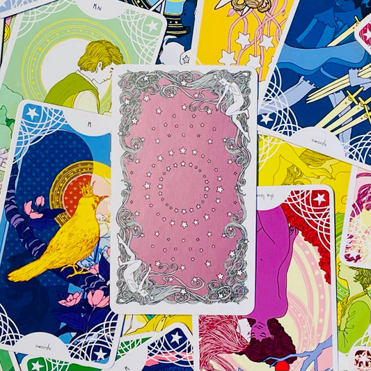 Cover art of the Star Spinner Tarot with collection of cards.