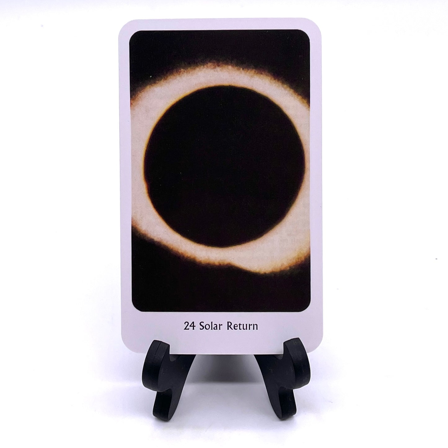 Photo of Card #24 "Solar Return" featuring a solar eclipse.