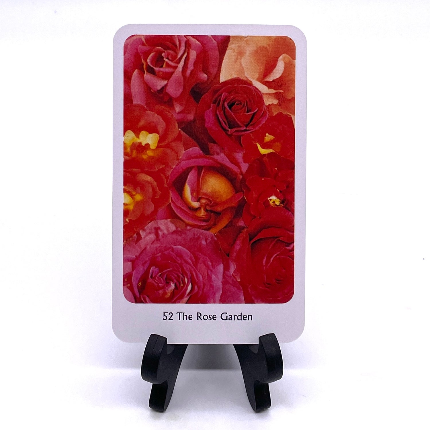 Photo of card #52 "The Rose Garden", featuring collaged images of roses in pink and red hues.