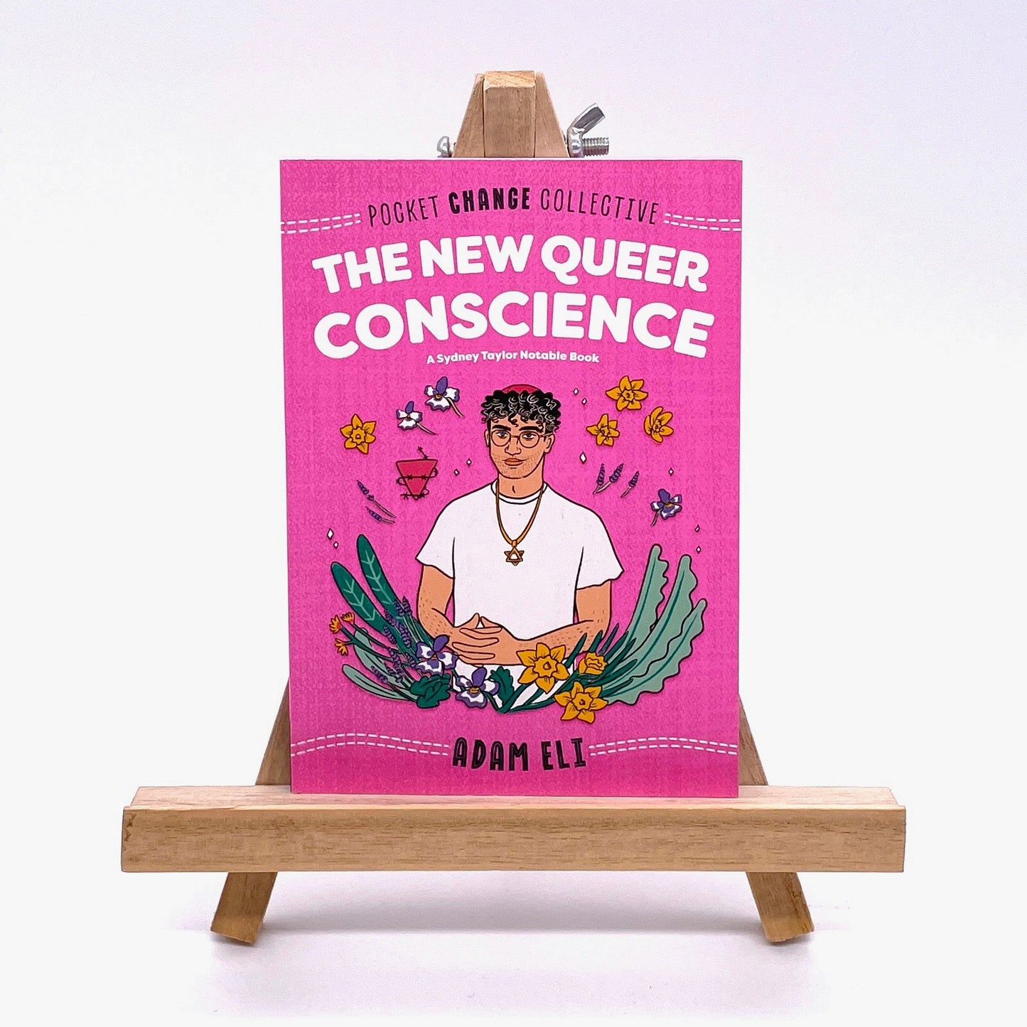 Cover of The New Queer Conscience by Adam Eli. There's a hand drawn image of the author, a queer person wearing a star of David necklace, set against a floral backdrop.