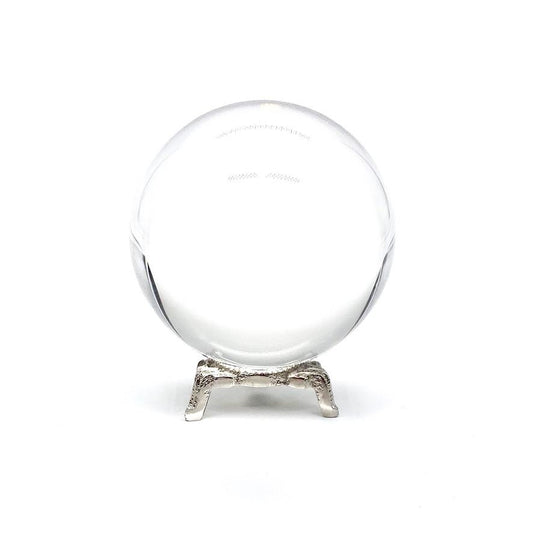 Small gazing crystal ball on silver stand.