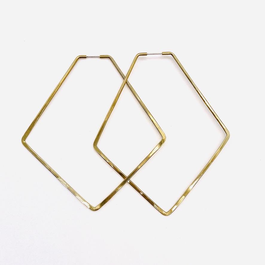 Brass geometric hoop earrings in anyo large shape.