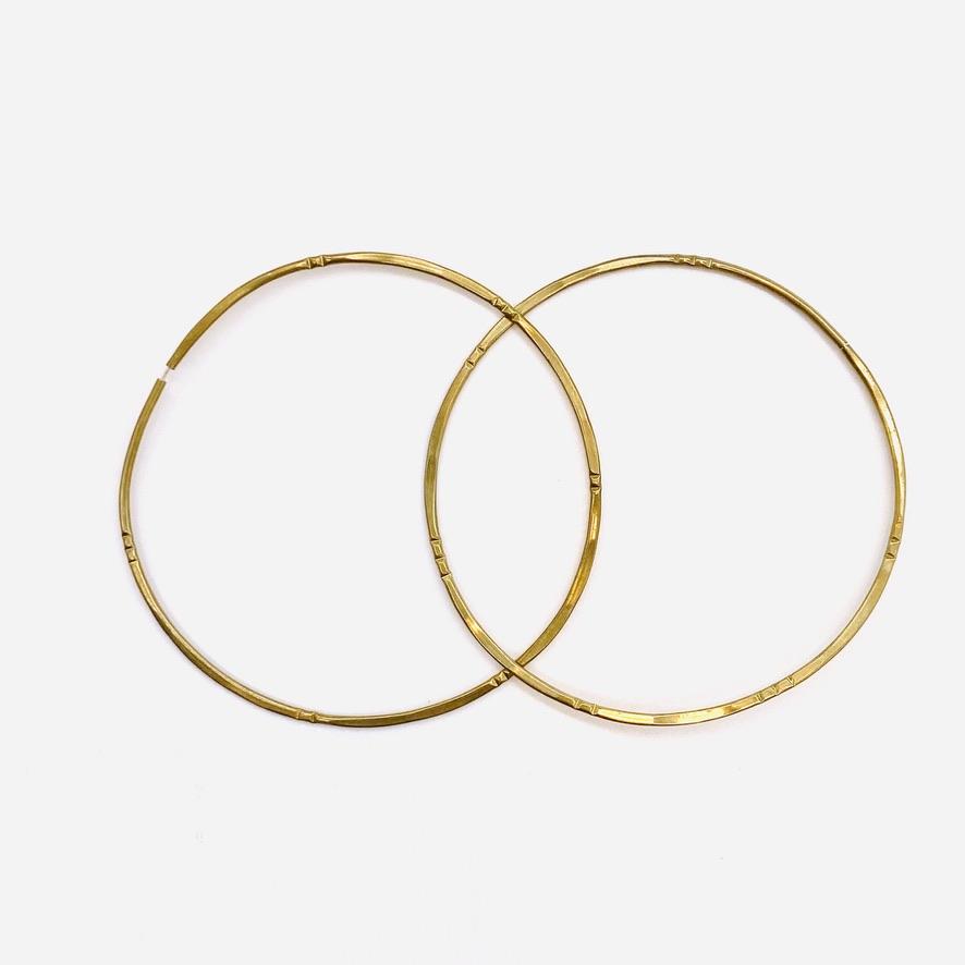 Brass geometric hoop earrings in bamboo solar large shape.