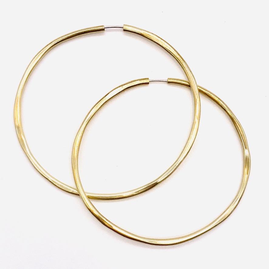 Brass geometric hoop earrings in dia large shape.
