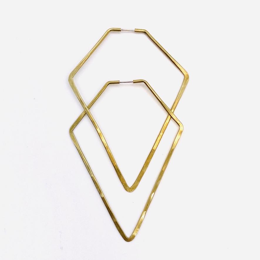 Brass geometric hoop earrings in high diamond shape.