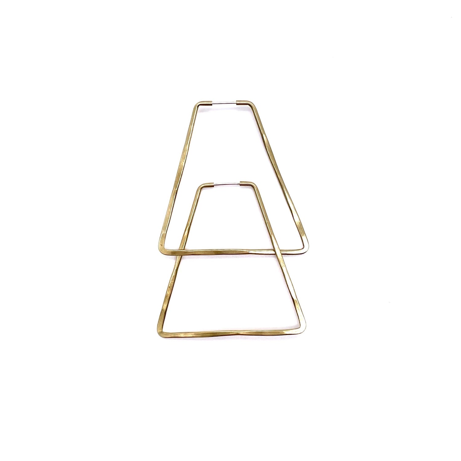 Brass geometric hoop earrings in mini triangle shape.