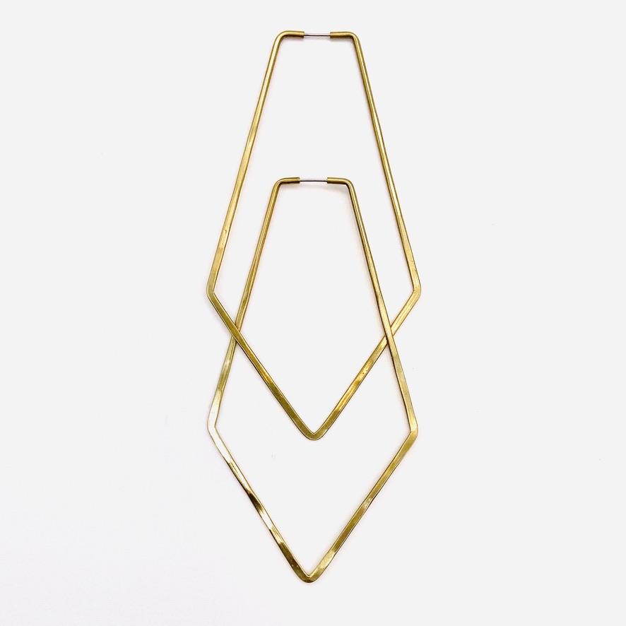 Brass geometric hoop earrings in north hoop shape.