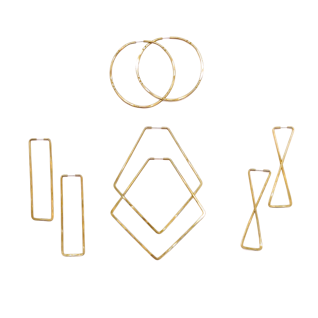 Brass geometric hoop earrings in various shapes.