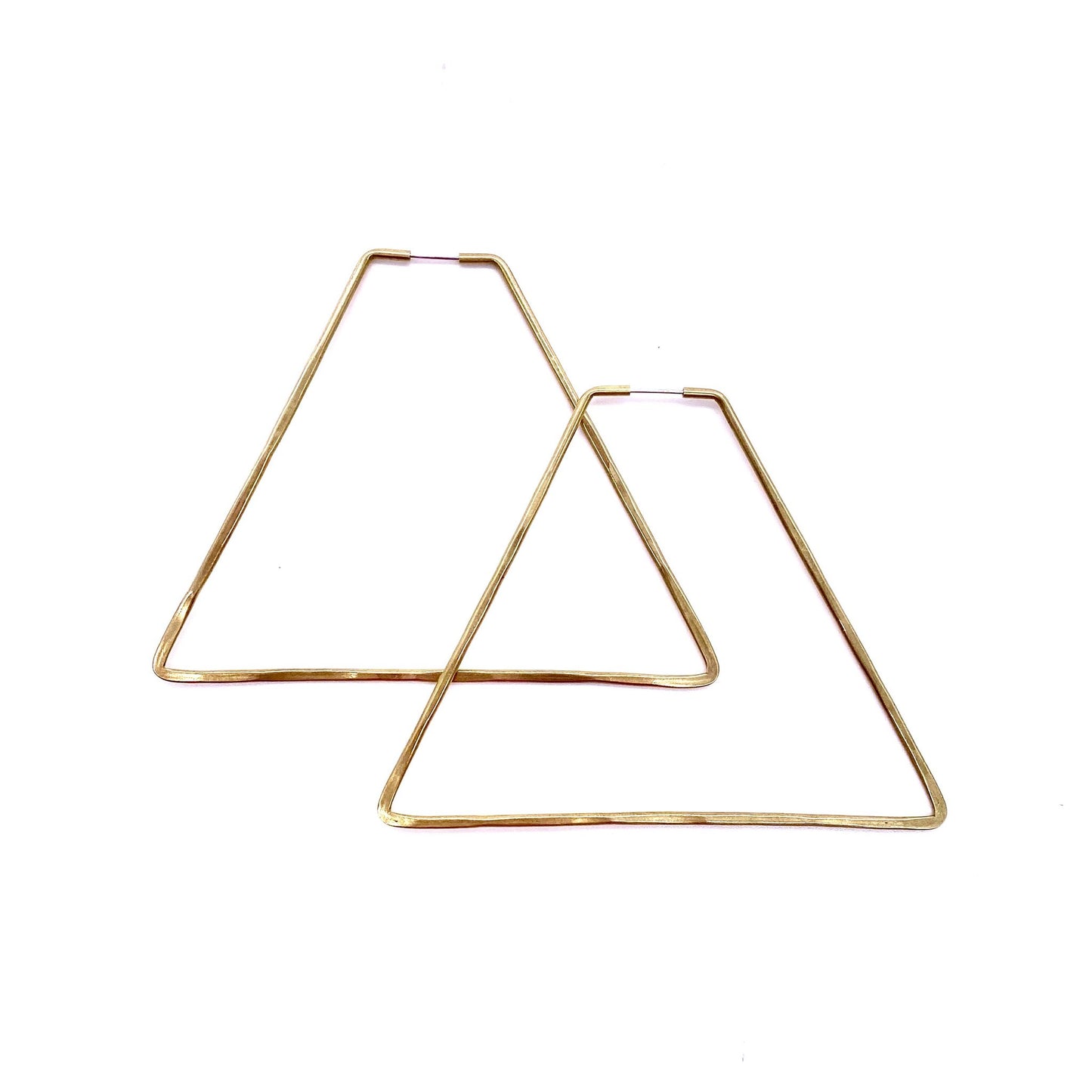 Brass geometric hoop earrings in pyramid shape.