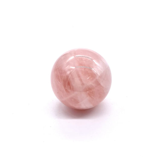 Rose quartz crystal in the shape of an orb.