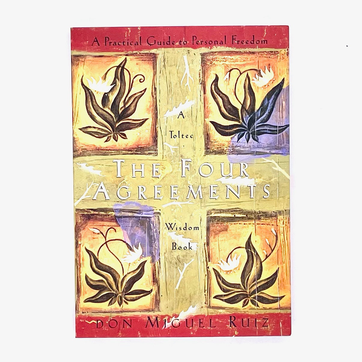 Book cover of The Four Agreements by Don Miguel Ruiz.
